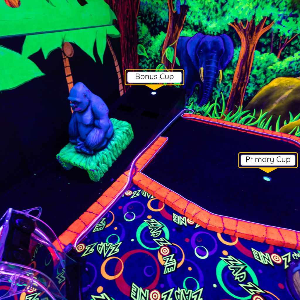 Overhead view of a mini golf hole with a gorilla obstacle featuring two different holes.