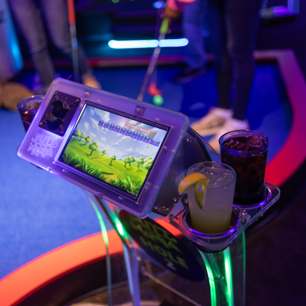 Putt Mania digital hole marker with beverages in the cup holders.