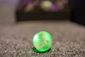Green illuminated Putt Mania golf ball.