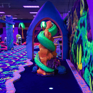 Sea creature themed indoor mini golf hole with Putt Mania technology.