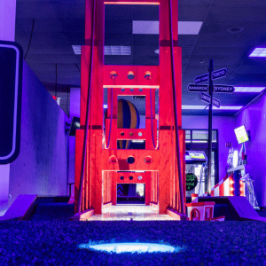 Illuminated Putt Mania cup on a Golden Gate Bridge themed mini golf hole.