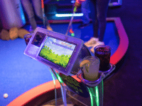 Putt Mania digital hole marker with beverages in the cup holders.