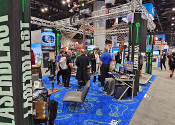 People at the LaserBlast booth at the 2024 IAAPA Expo.